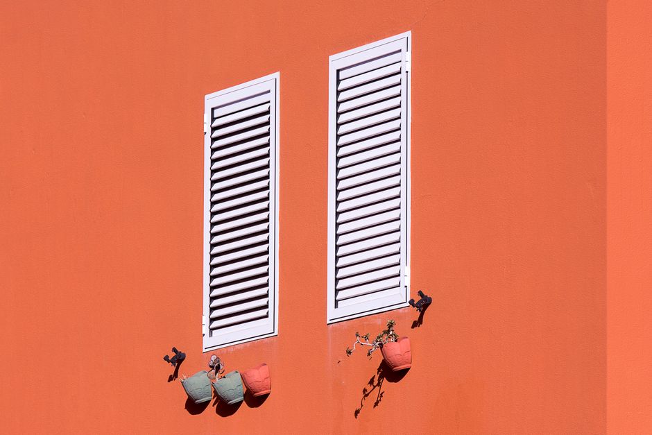 White plantation window shutters